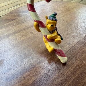 Disney Yellow Winnie the Pooh on Red-and-Cream Candy Cane Ornament